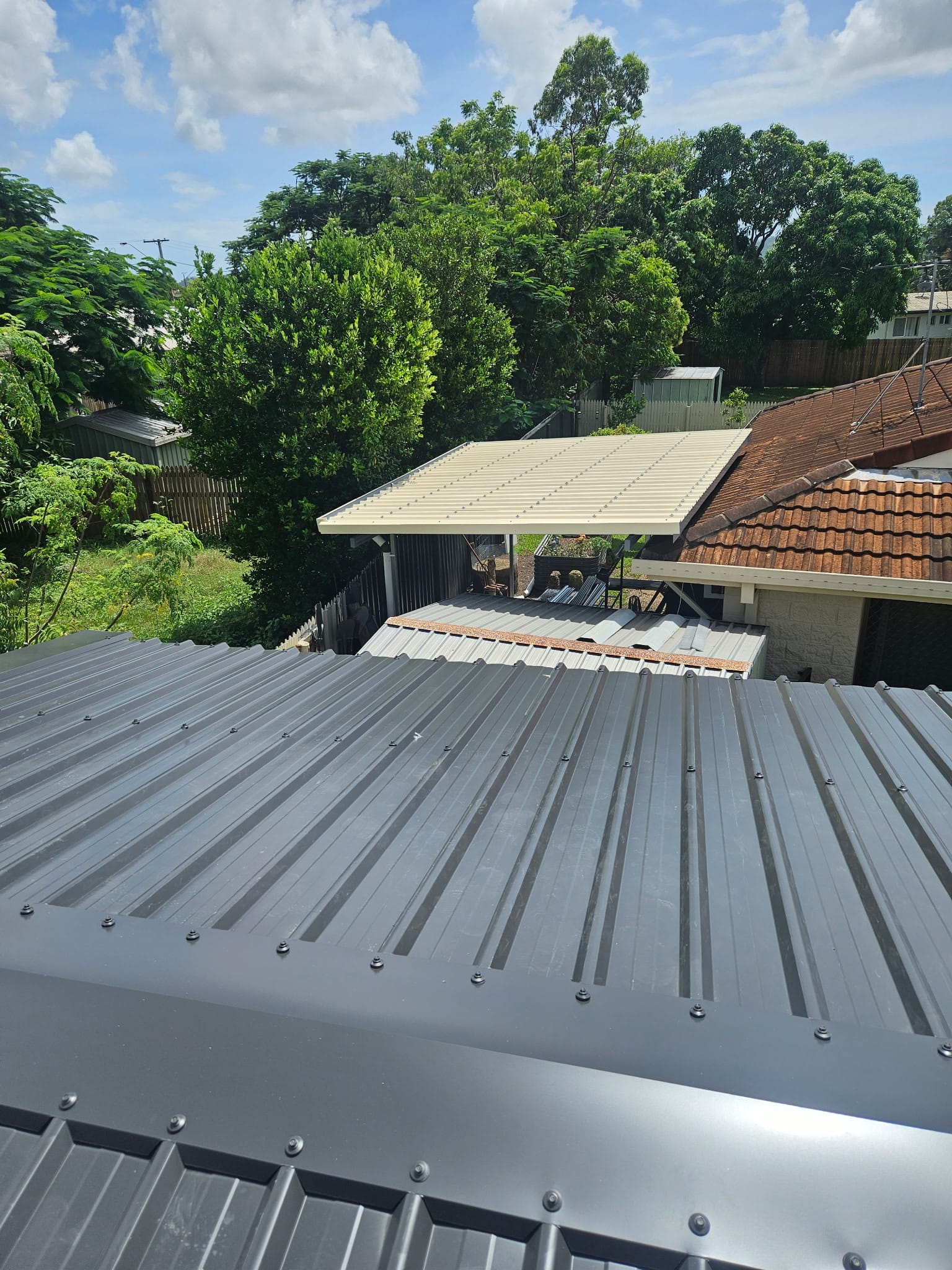 View over newly installed roofing and nearby patio